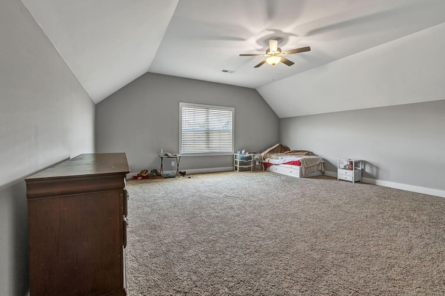 unfurnished bedroom featuring ceiling fan, lofted ceiling, and carpet