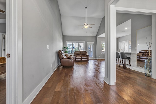 living room featuring high vaulted ceiling, dark hardwood / wood-style floors, and ceiling fan