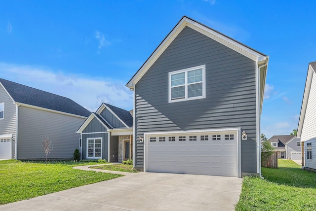 view of property with a garage and a front yard