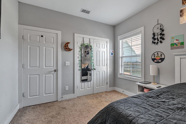 carpeted bedroom with a closet