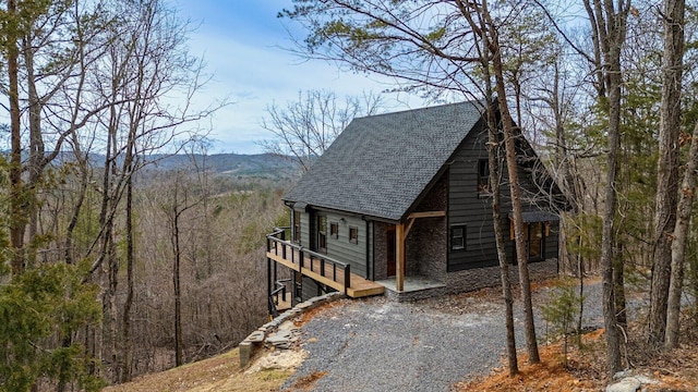 view of side of property with a mountain view