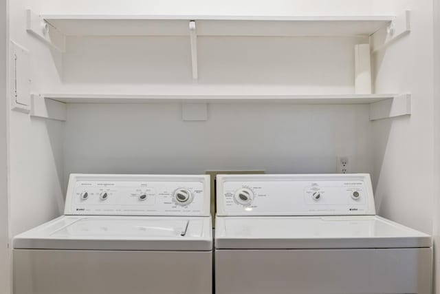 clothes washing area featuring separate washer and dryer