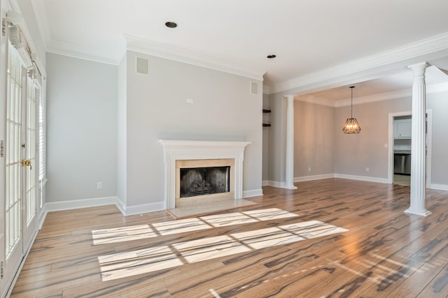 unfurnished living room with crown molding, light hardwood / wood-style flooring, and ornate columns