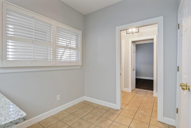 empty room with light tile patterned flooring