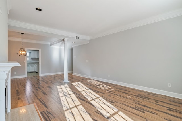 interior space featuring ornamental molding, a chandelier, and light hardwood / wood-style flooring