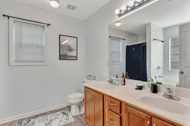 full bathroom with vanity, toilet, independent shower and bath, and hardwood / wood-style floors