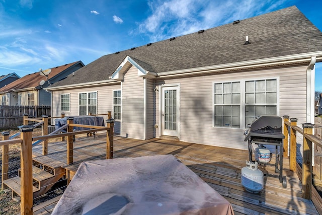 rear view of property with a deck