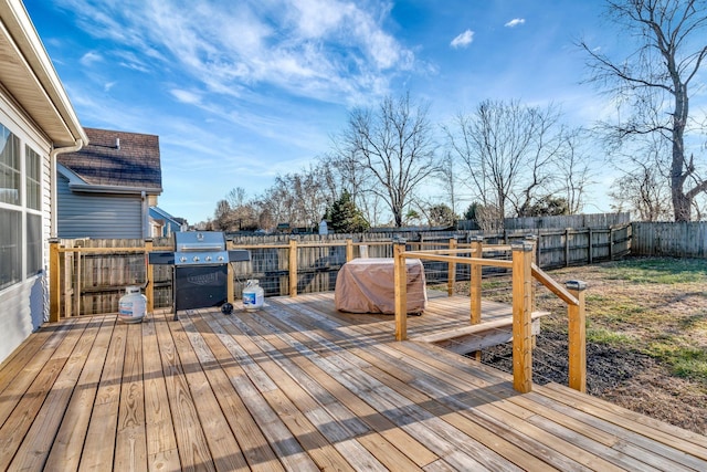 deck featuring a grill