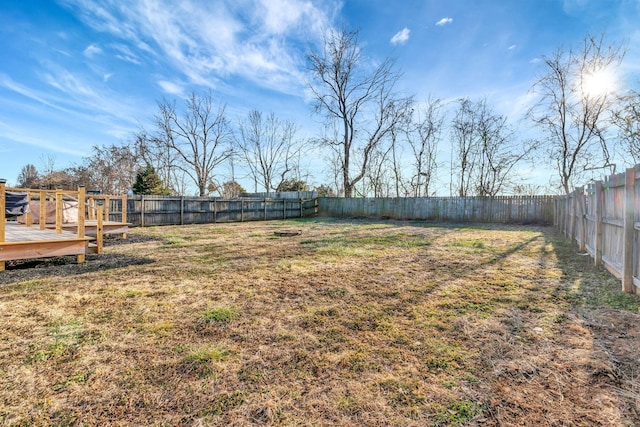 view of yard featuring a wooden deck