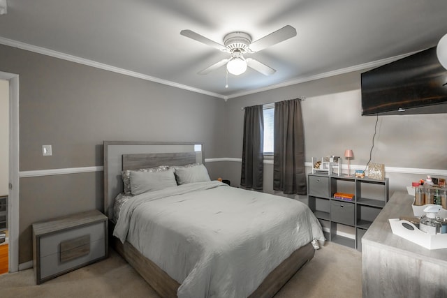 bedroom with crown molding, ceiling fan, and carpet flooring