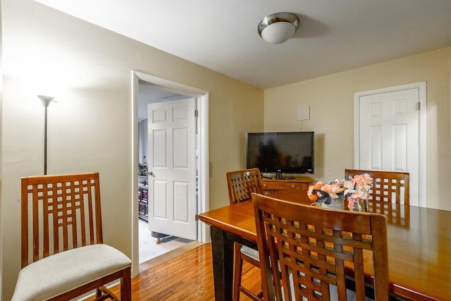 dining space featuring light wood-type flooring