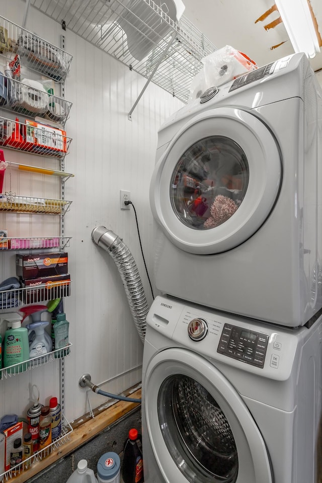 laundry area featuring stacked washer and clothes dryer