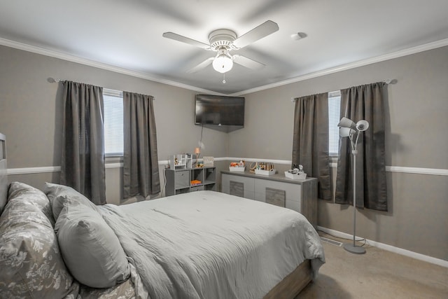 bedroom featuring crown molding, carpet floors, and ceiling fan