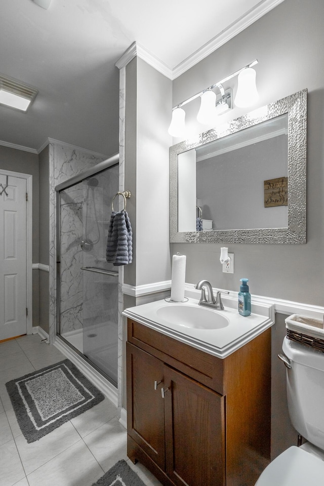 bathroom featuring ornamental molding, toilet, a shower with shower door, and vanity