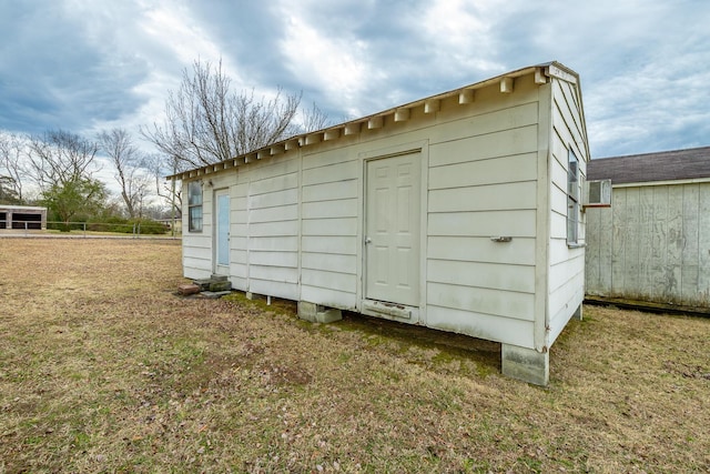 view of outdoor structure with a yard