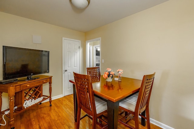 dining space featuring light wood-type flooring