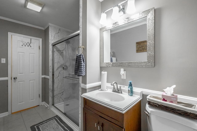 bathroom with crown molding, vanity, a shower with shower door, tile patterned floors, and toilet