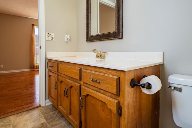 bathroom with vanity and toilet