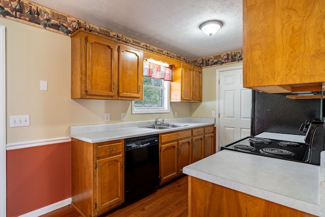 kitchen with dishwasher, sink, dark hardwood / wood-style flooring, stove, and a textured ceiling