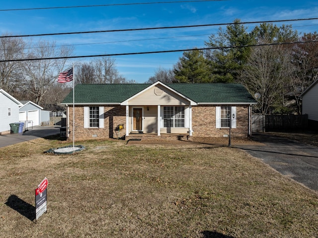 view of front of property with covered porch and a front yard