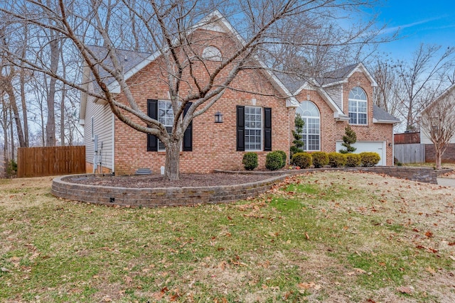 front facade featuring a garage and a front lawn