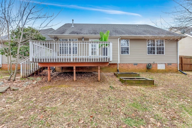 rear view of house featuring a wooden deck