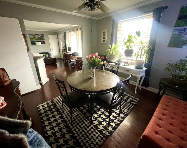 dining space with ceiling fan, ornamental molding, and dark hardwood / wood-style flooring