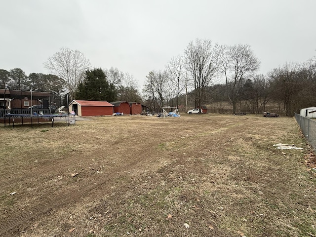 view of yard with a trampoline