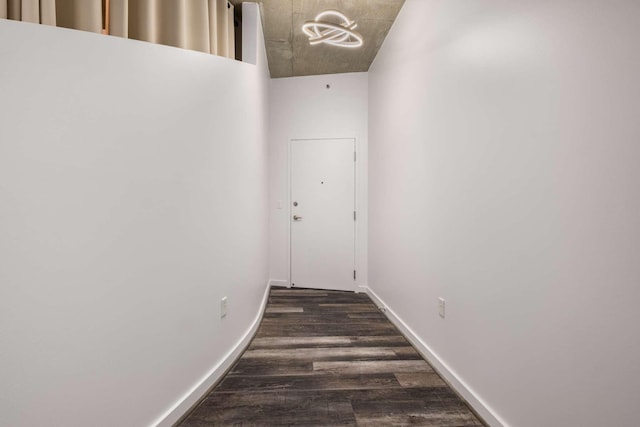 hallway featuring dark hardwood / wood-style flooring