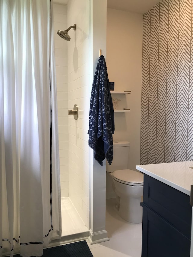 bathroom with toilet and a shower with curtain