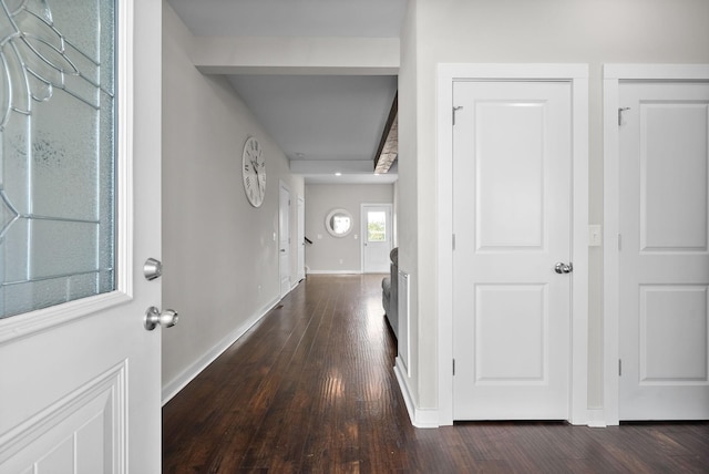 hall with dark wood-type flooring