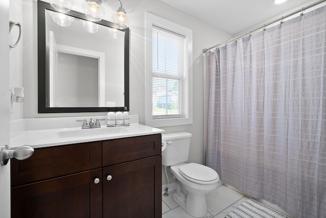 bathroom with vanity, curtained shower, and toilet