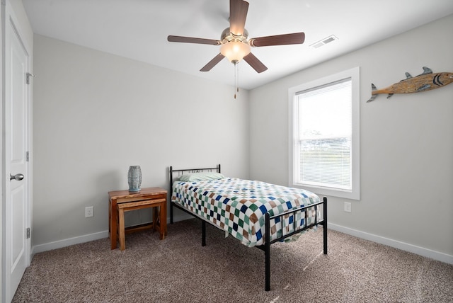 bedroom featuring ceiling fan and carpet