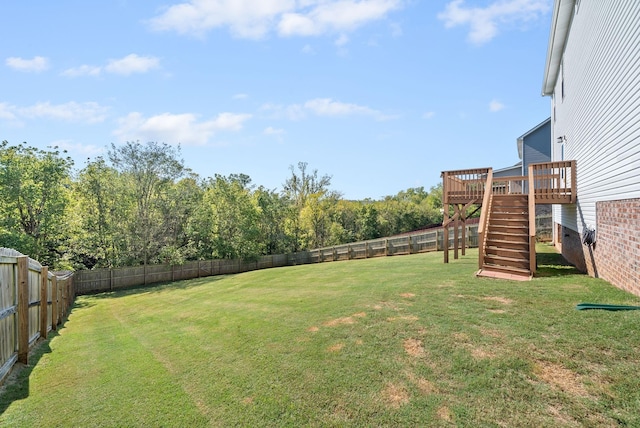 view of yard with a wooden deck