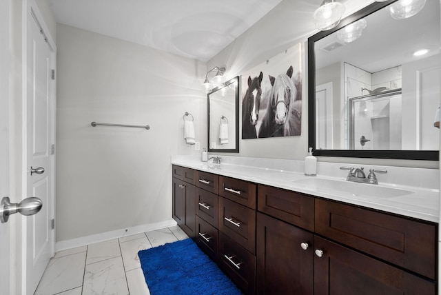 bathroom featuring vanity and an enclosed shower