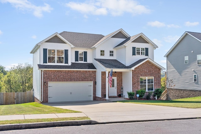 view of front of property with a garage and a front yard