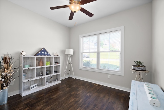 misc room featuring dark hardwood / wood-style floors and ceiling fan