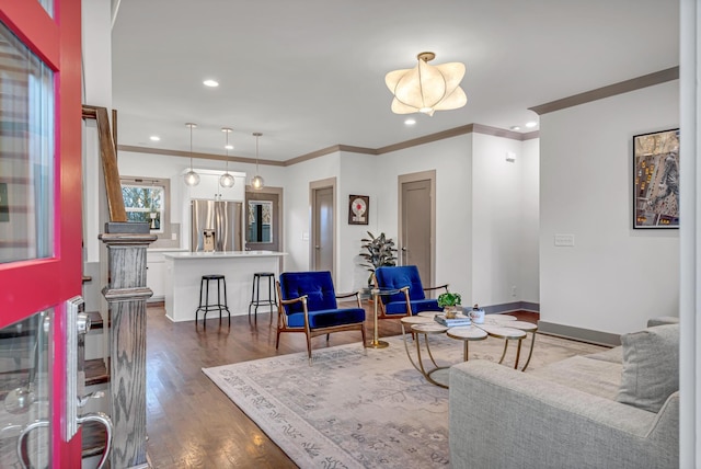 living room featuring crown molding and dark hardwood / wood-style flooring