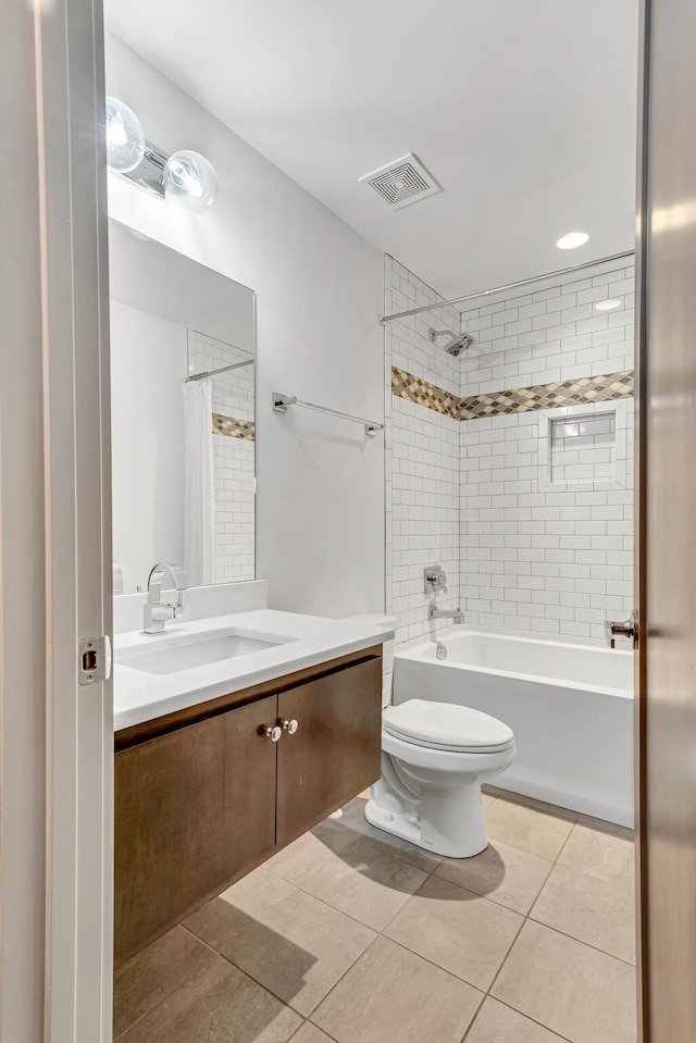 full bathroom featuring shower / tub combo, vanity, toilet, and tile patterned flooring