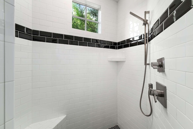 bathroom featuring tiled shower