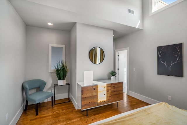 sitting room featuring wood-type flooring