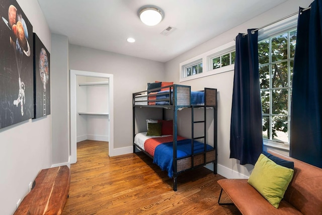 bedroom with hardwood / wood-style floors