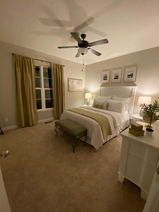 bedroom featuring ceiling fan, visible vents, and carpet flooring