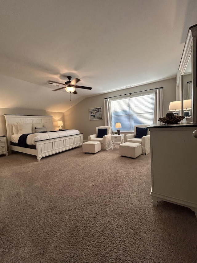 carpeted bedroom featuring vaulted ceiling and a ceiling fan