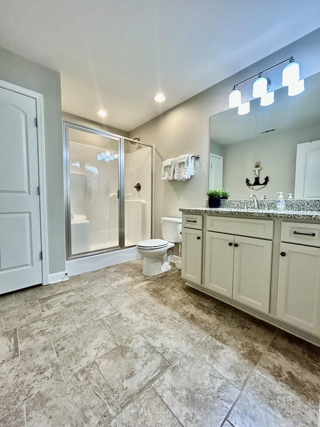 full bathroom with visible vents, a shower stall, toilet, and vanity