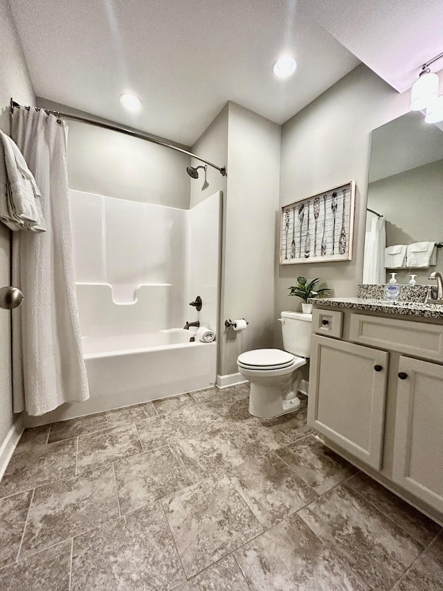 full bath featuring toilet, shower / tub combo, vanity, a textured ceiling, and baseboards