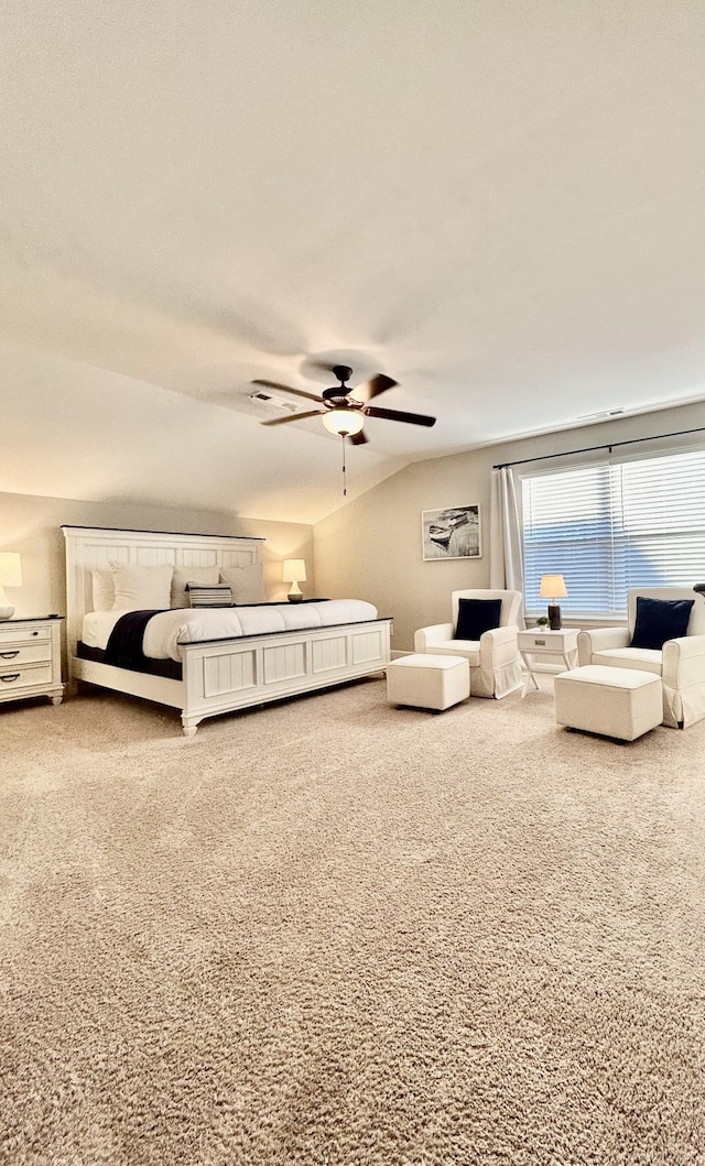 carpeted bedroom featuring vaulted ceiling and a ceiling fan