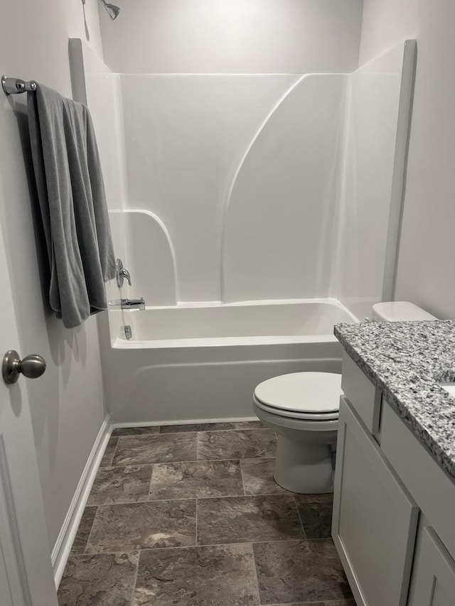 full bathroom with vanity, tub / shower combination, and toilet