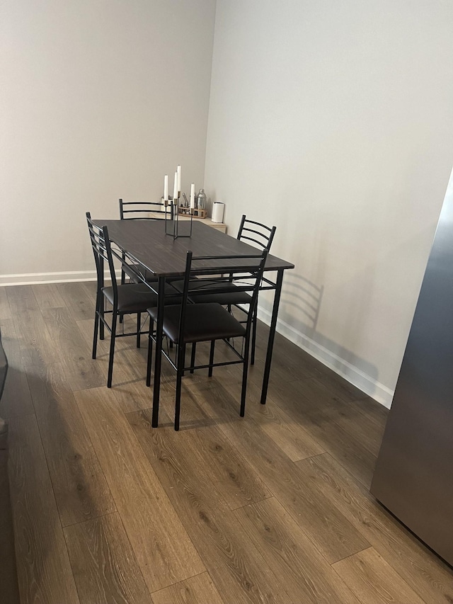 dining room with dark wood-type flooring