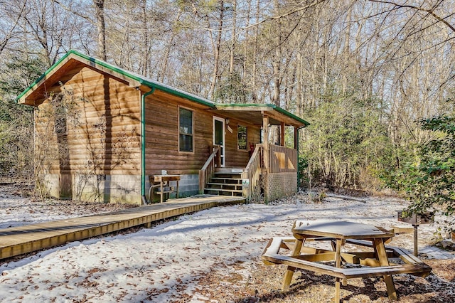 view of snow covered house